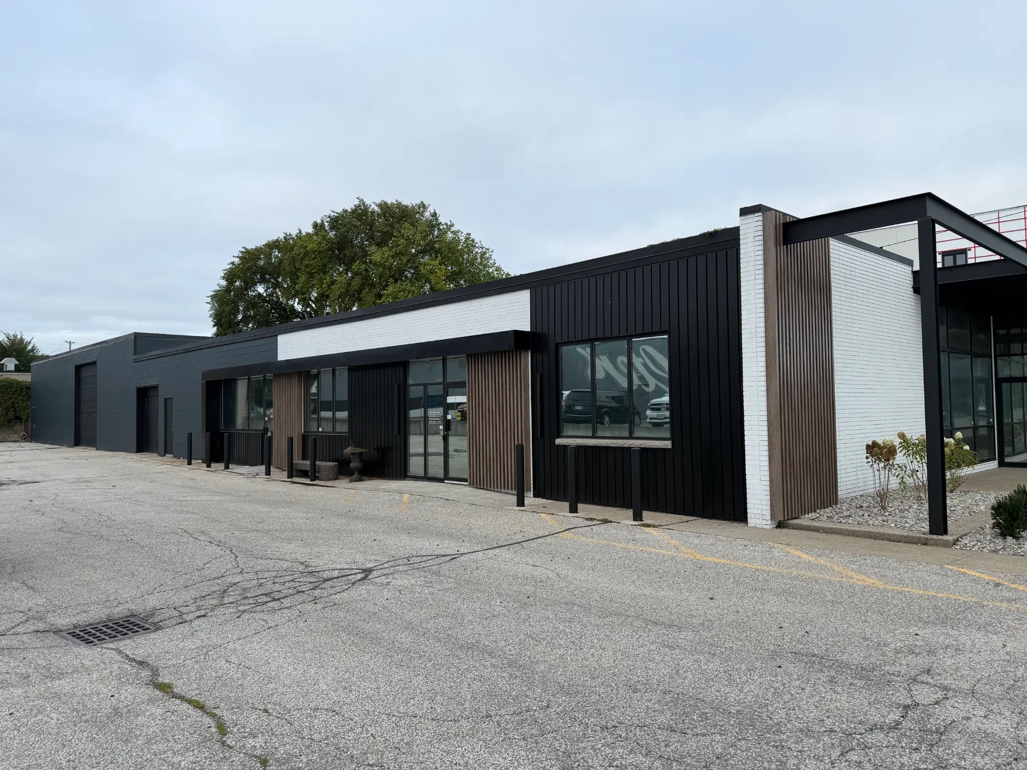 Refreshed commercial office exterior at 1225 McDougall St, Windsor, with contrasting dark and light facade finishes
